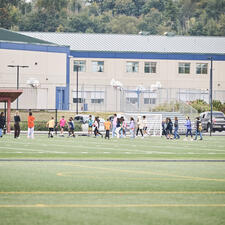 Children playing soccer on Sophie Schmidt Field